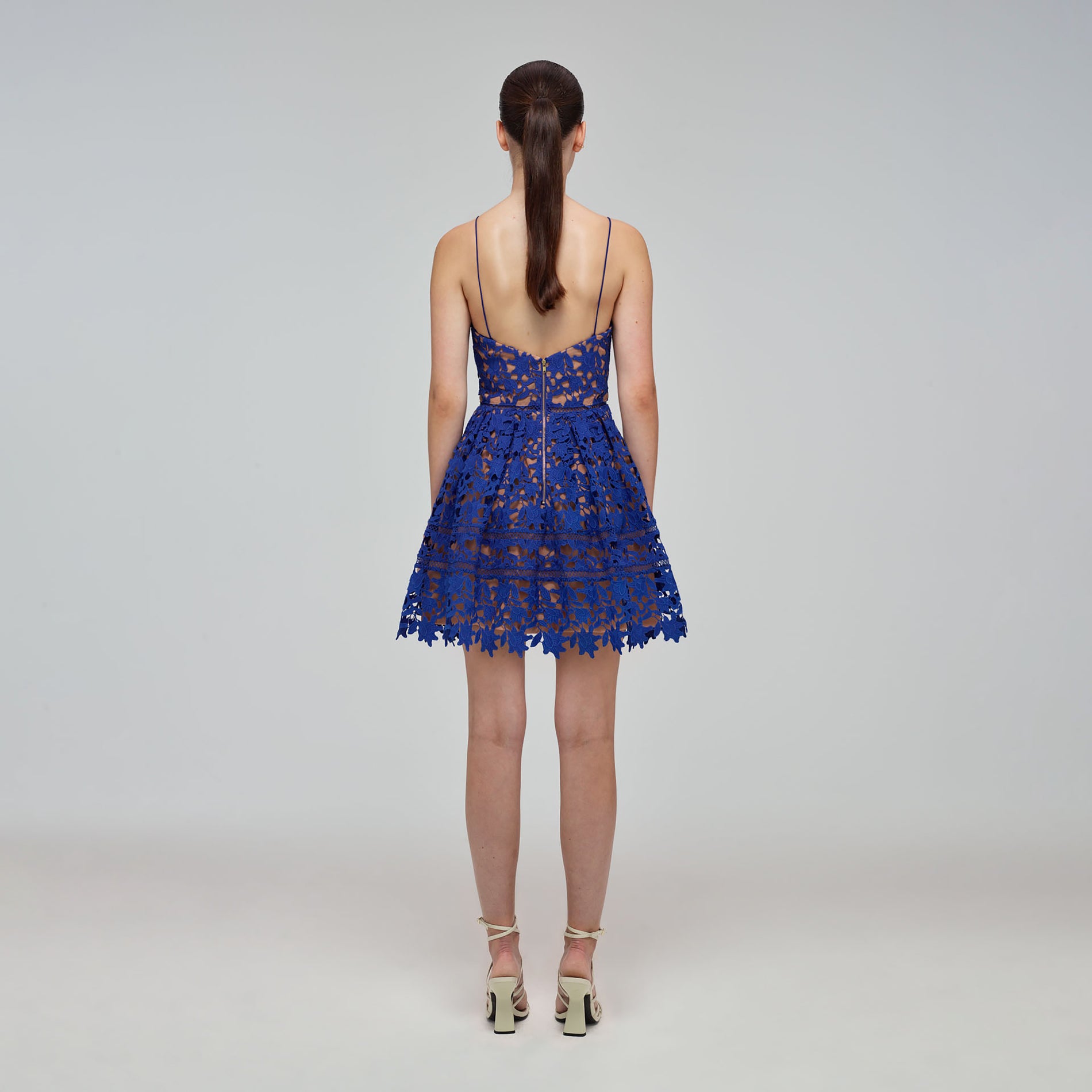 A woman wearing the Deep Blue Azaelea Mini Dress