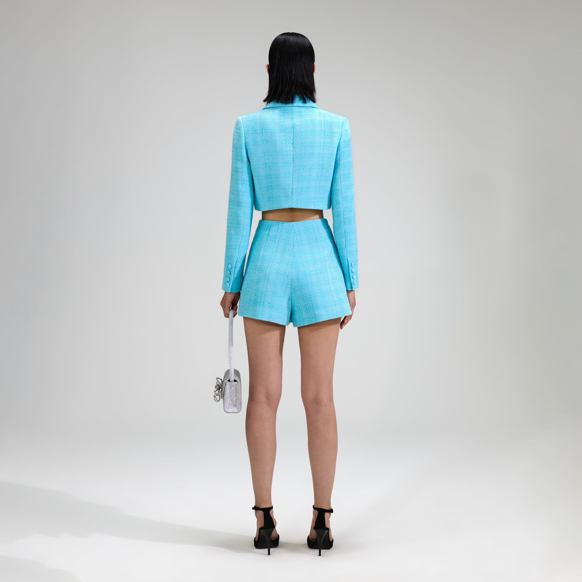 A woman wearing the Blue Boucle Skort