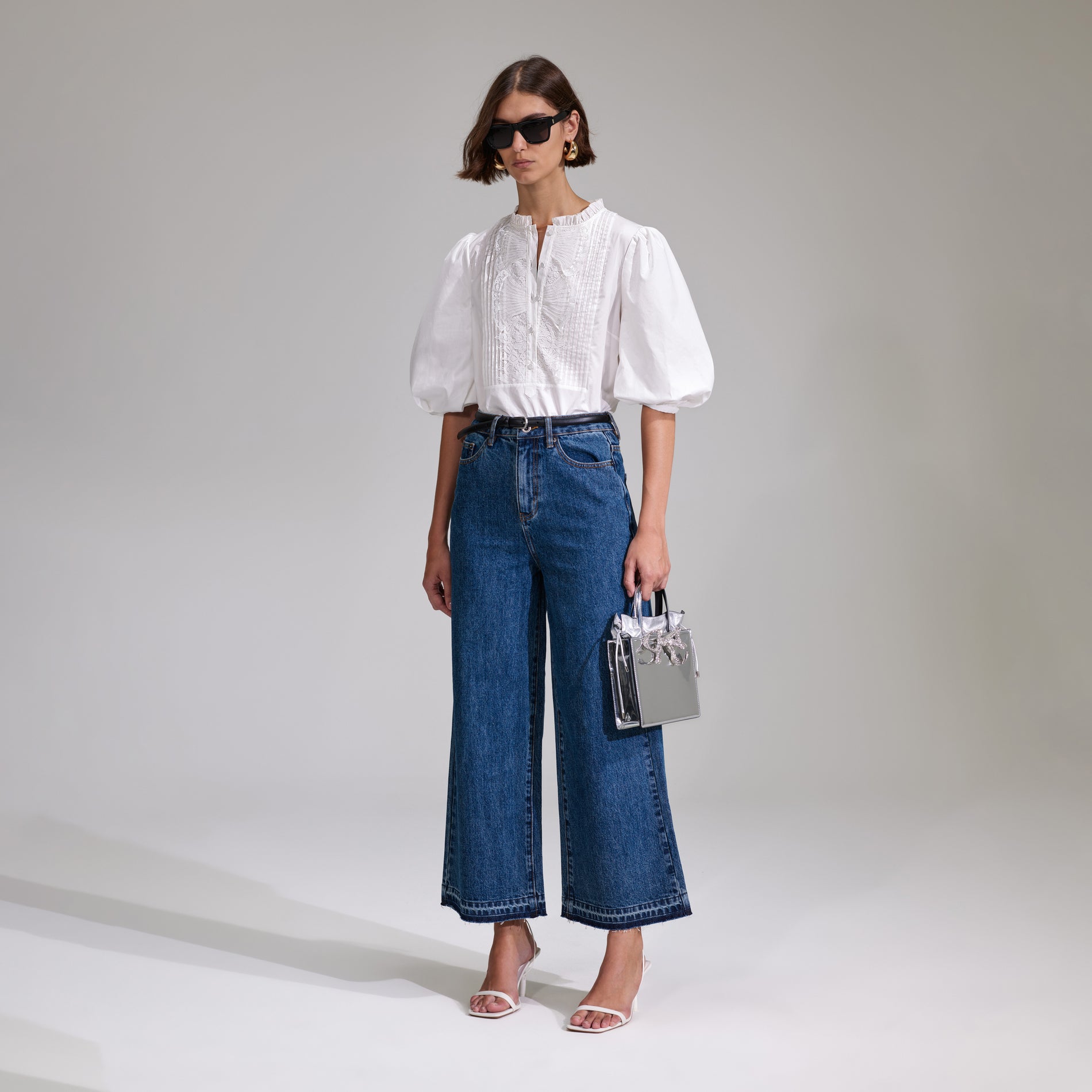 A woman wearing the White Cotton Poplin Top