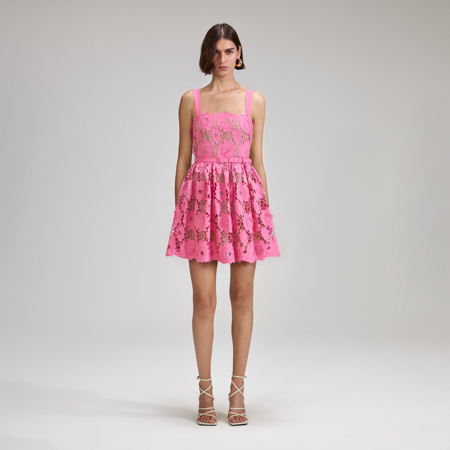 A woman wearing the Pink 3D Cotton Lace Mini Dress