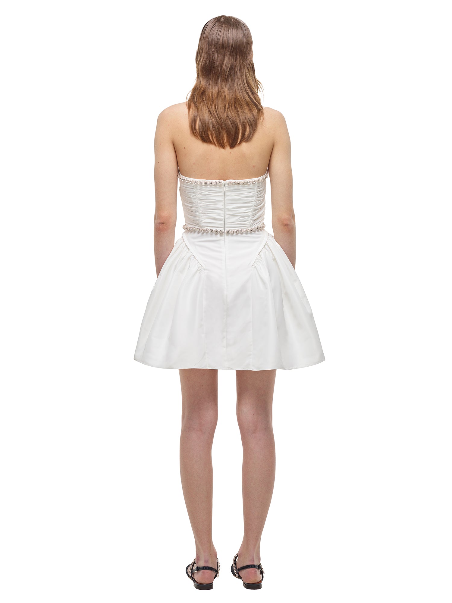 A woman wearing the White Taffeta Diamante Trim Mini Dress