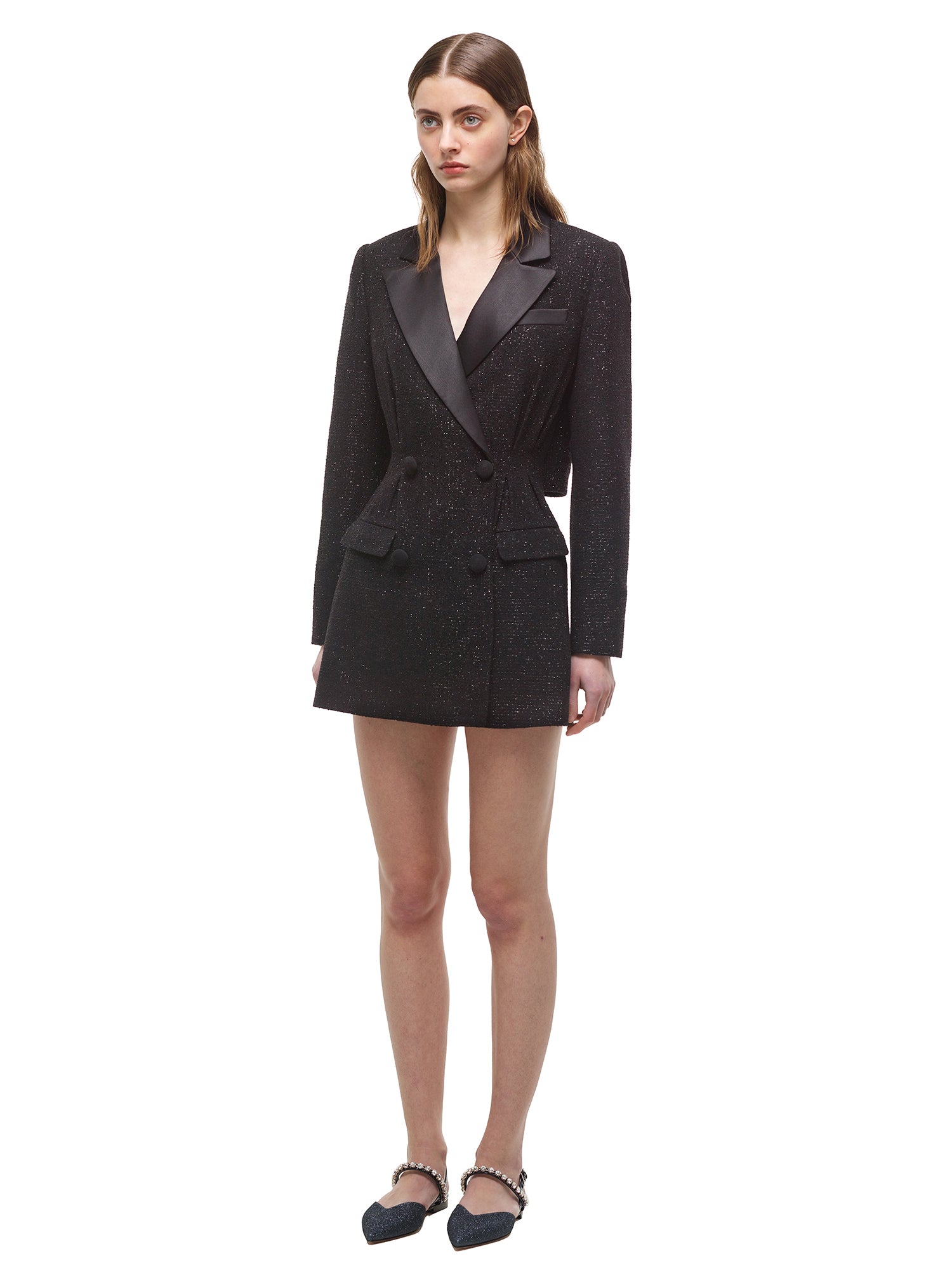 A woman wearing the Black Metallic Tunic