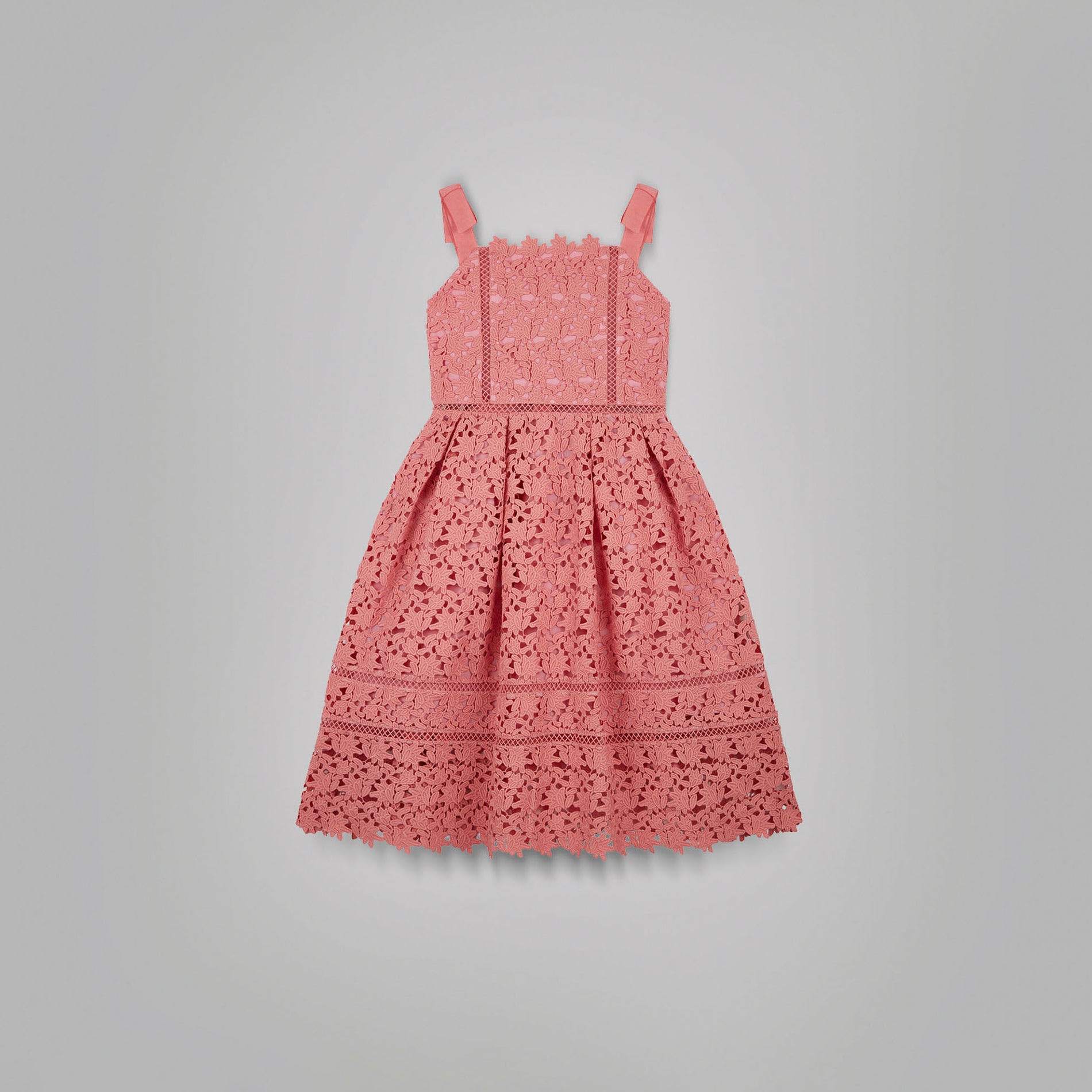 A woman wearing the Pink Azaelea Bow Detail Midi Dress