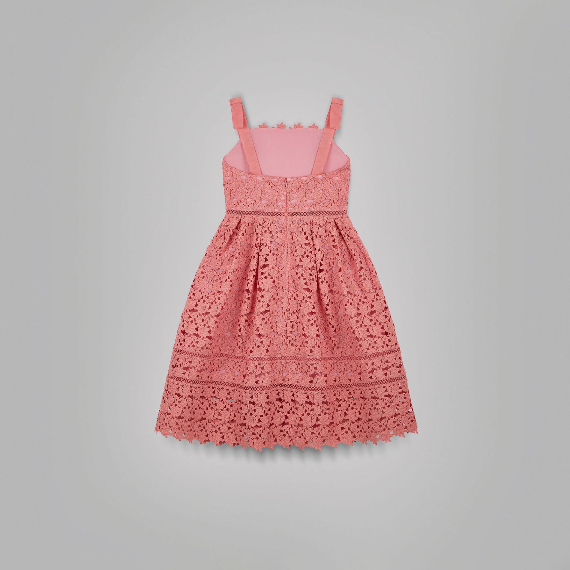 A woman wearing the Pink Azaelea Bow Detail Midi Dress