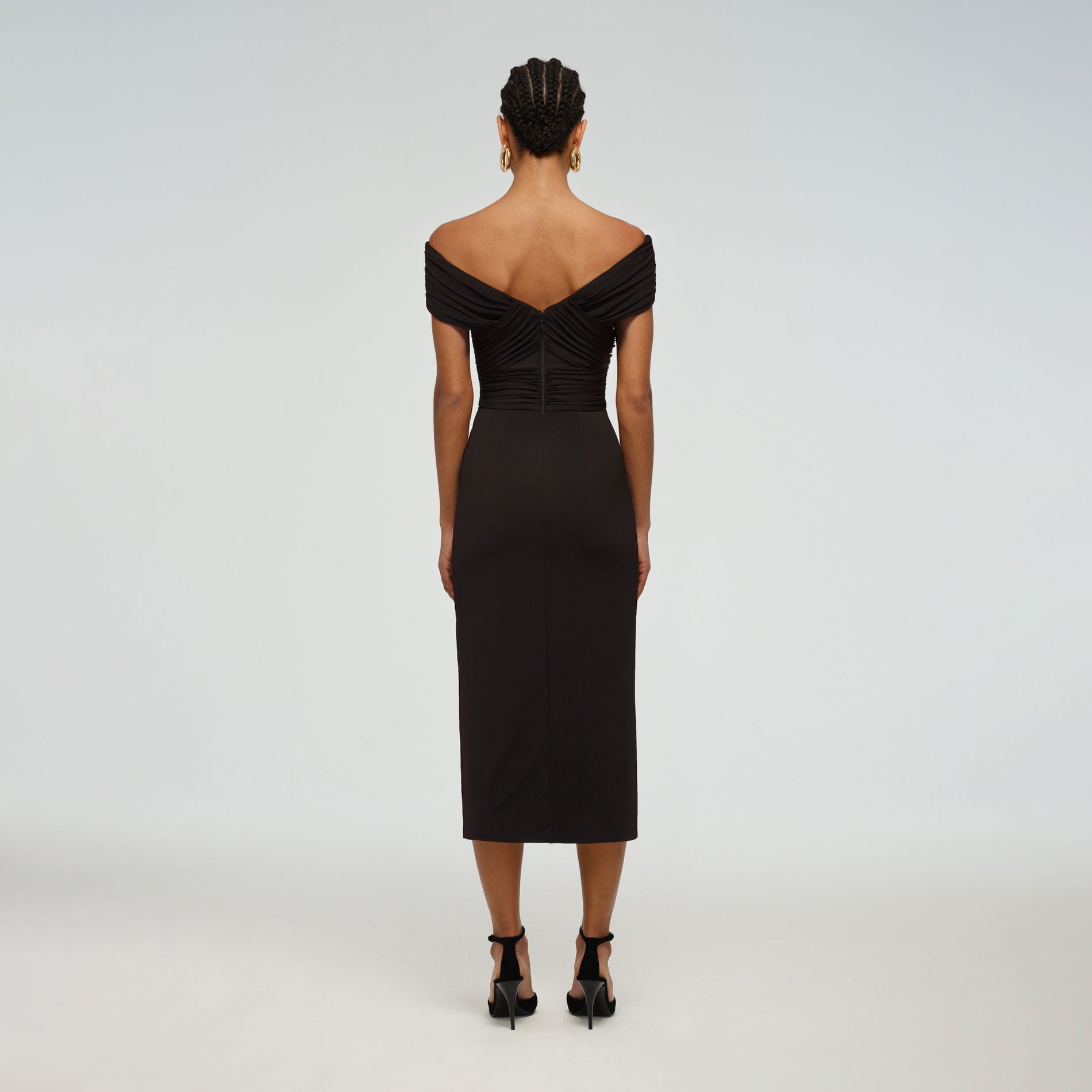 A woman wearing the Crossover Midi Dress