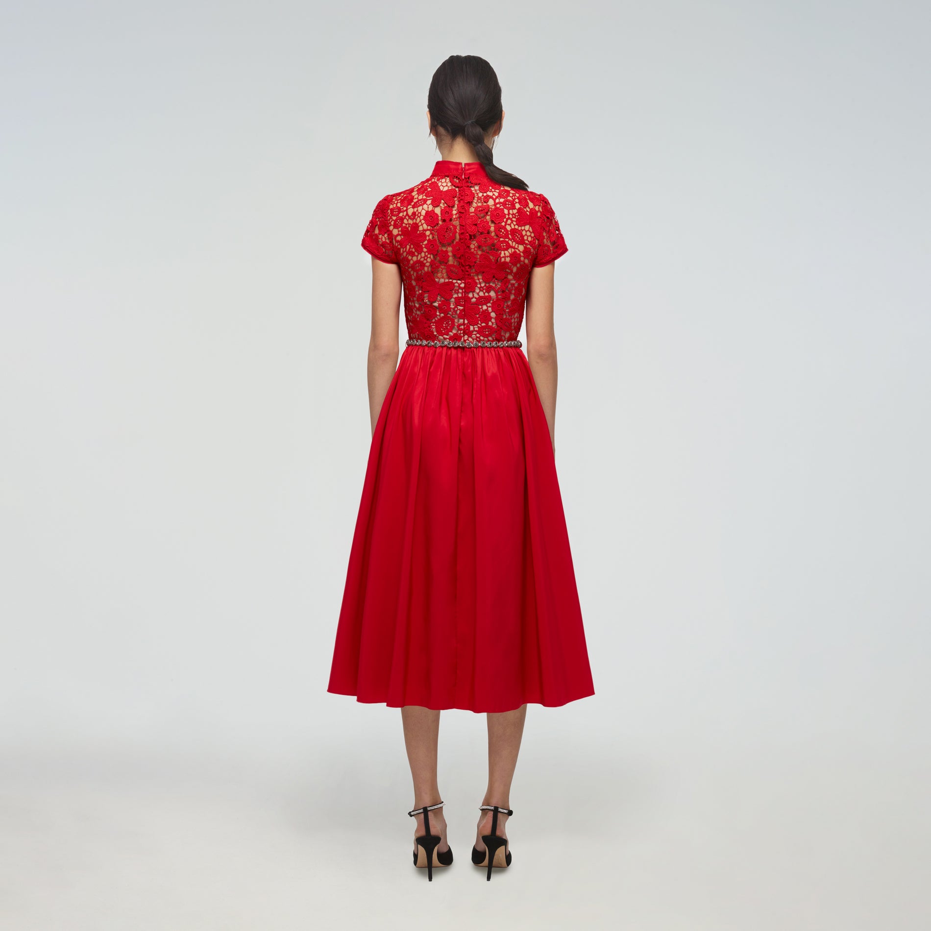 A woman wearing the Red Guipure Lace and Taffeta Midi Dress